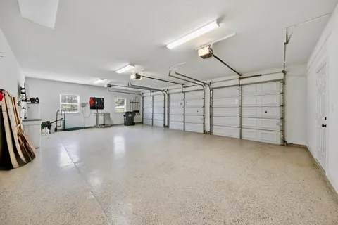 a view of a yard with large trees