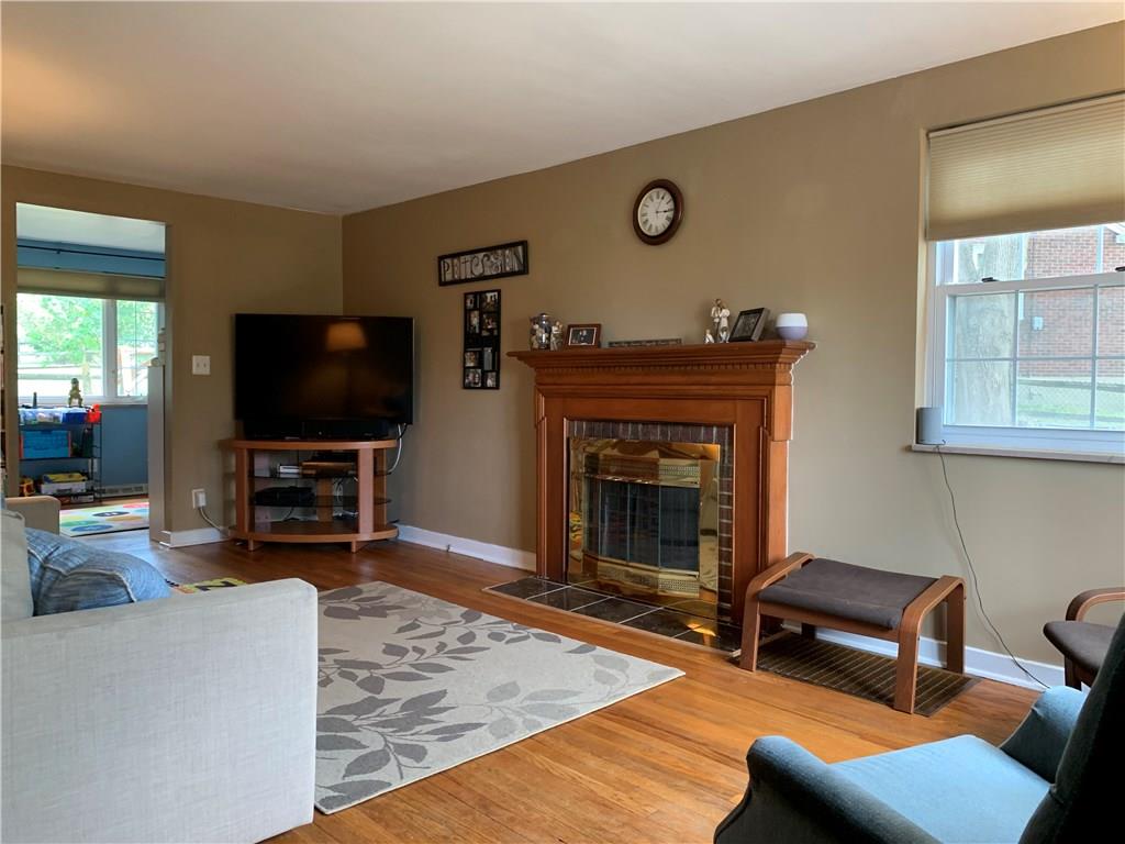 1140 Hazlett Road Pittsburgh, PA 15237 - Photo 13 of 25 Living room boasts fireplace, hardwood floors and custom blinds