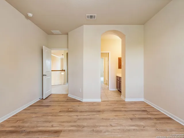 a living room with furniture a large window and a flat screen tv