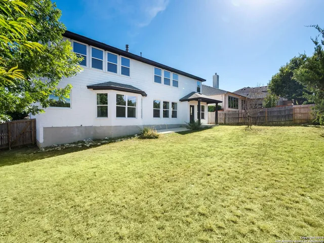 an aerial view of a house with a ocean view