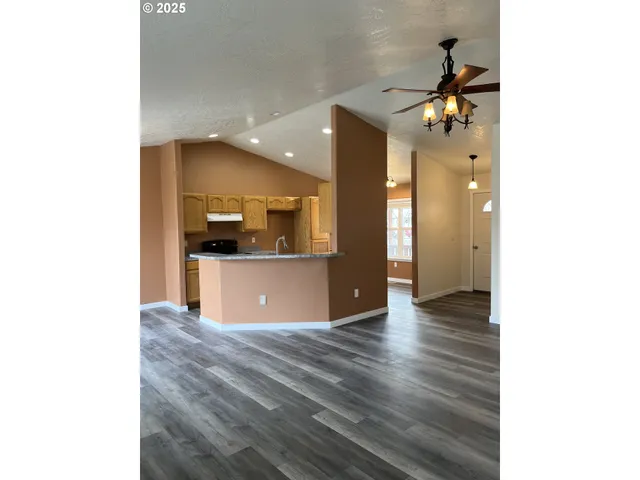 a view of a kitchen with a sink and a kitchen view