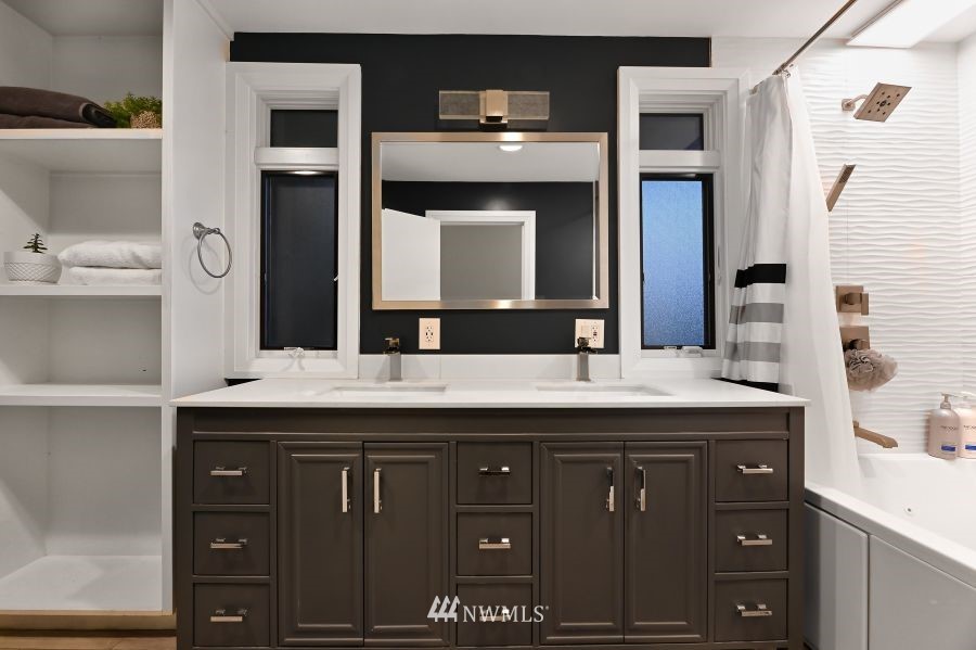 424 Fieldston Road Bellingham, WA 98225 - Photo 18 of 39 a bathroom with a granite countertop sink and a mirror