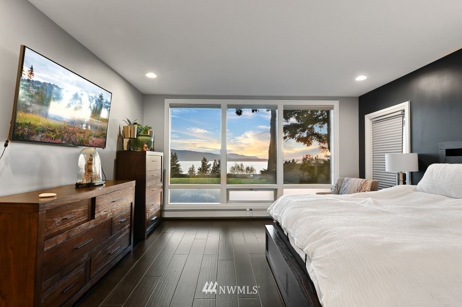 424 Fieldston Road Bellingham, WA 98225 - Photo 21 of 39 a bedroom with a bed and large flat screen tv