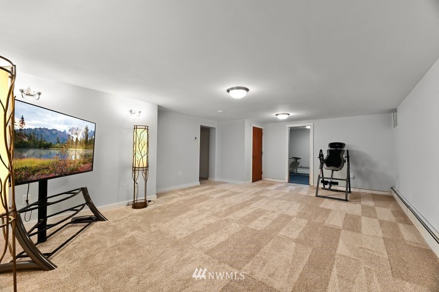 424 Fieldston Road Bellingham, WA 98225 - Photo 27 of 39 a view of a livingroom with furniture and a flat screen tv