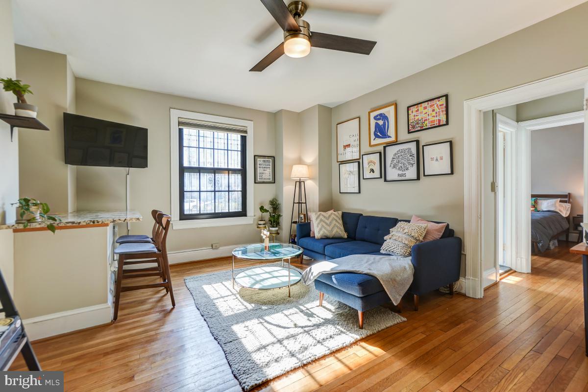 1101 L Street Northwest, Unit 102 Washington, DC 20005 - Photo 13 of 38 Bright and sunny living room