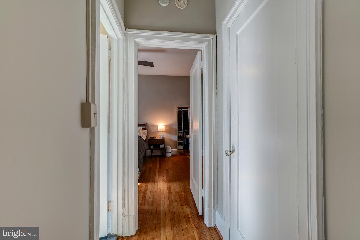 1101 L Street Northwest, Unit 102 Washington, DC 20005 - Photo 23 of 38 Hallway to bedroom with extra hall closet