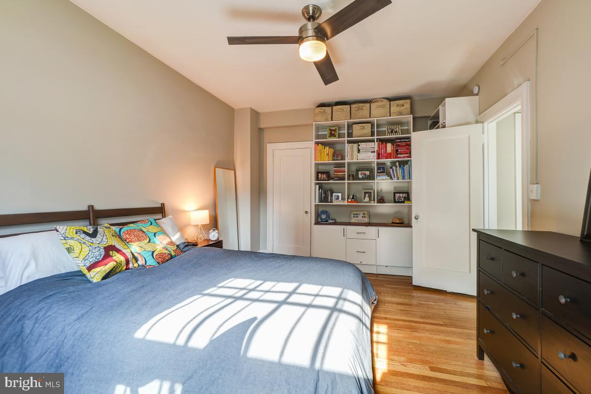 1101 L Street Northwest, Unit 102 Washington, DC 20005 - Photo 26 of 38 Large bedroom with built-in bookcase and wardrobe