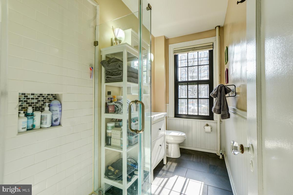 1101 L Street Northwest, Unit 102 Washington, DC 20005 - Photo 31 of 38 Custom frameless glass-enclosed shower
