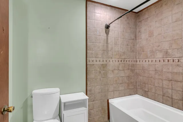 a bathroom with a toilet and sink