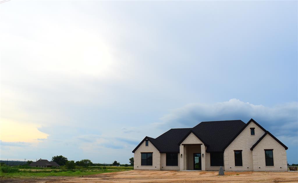 151 County Road 2610 Decatur, TX 76234 - Photo 2 of 38 View of front of property featuring brick siding and roof with shingles