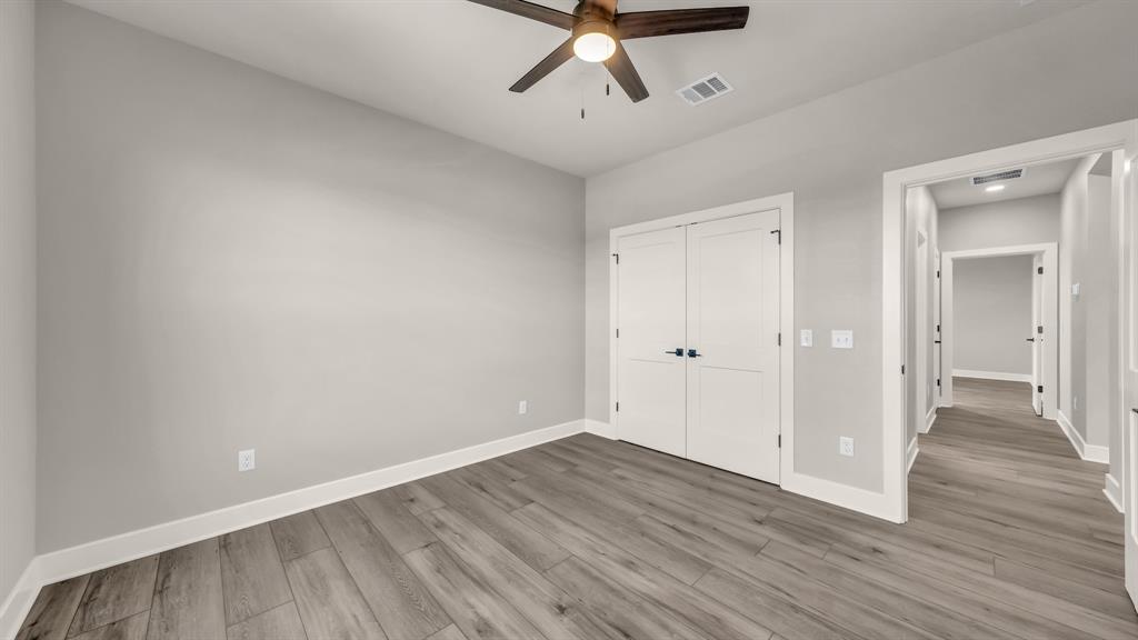 151 County Road 2610 Decatur, TX 76234 - Photo 29 of 38 Split floorpan with secondary bedrooms on one side of the home and the primary on the other