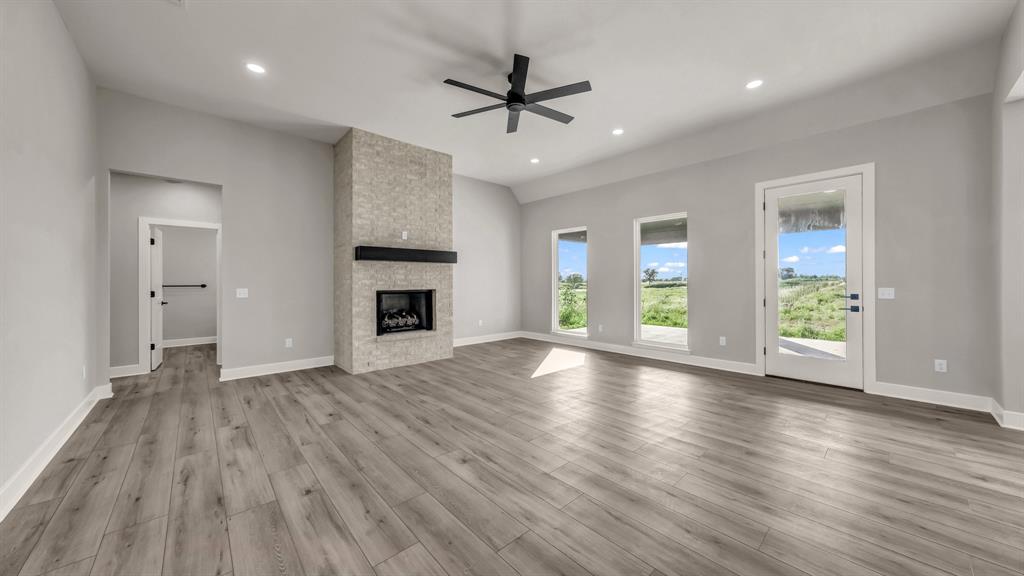 151 County Road 2610 Decatur, TX 76234 - Photo 8 of 38 Large open living into kitchen with gas fireplace