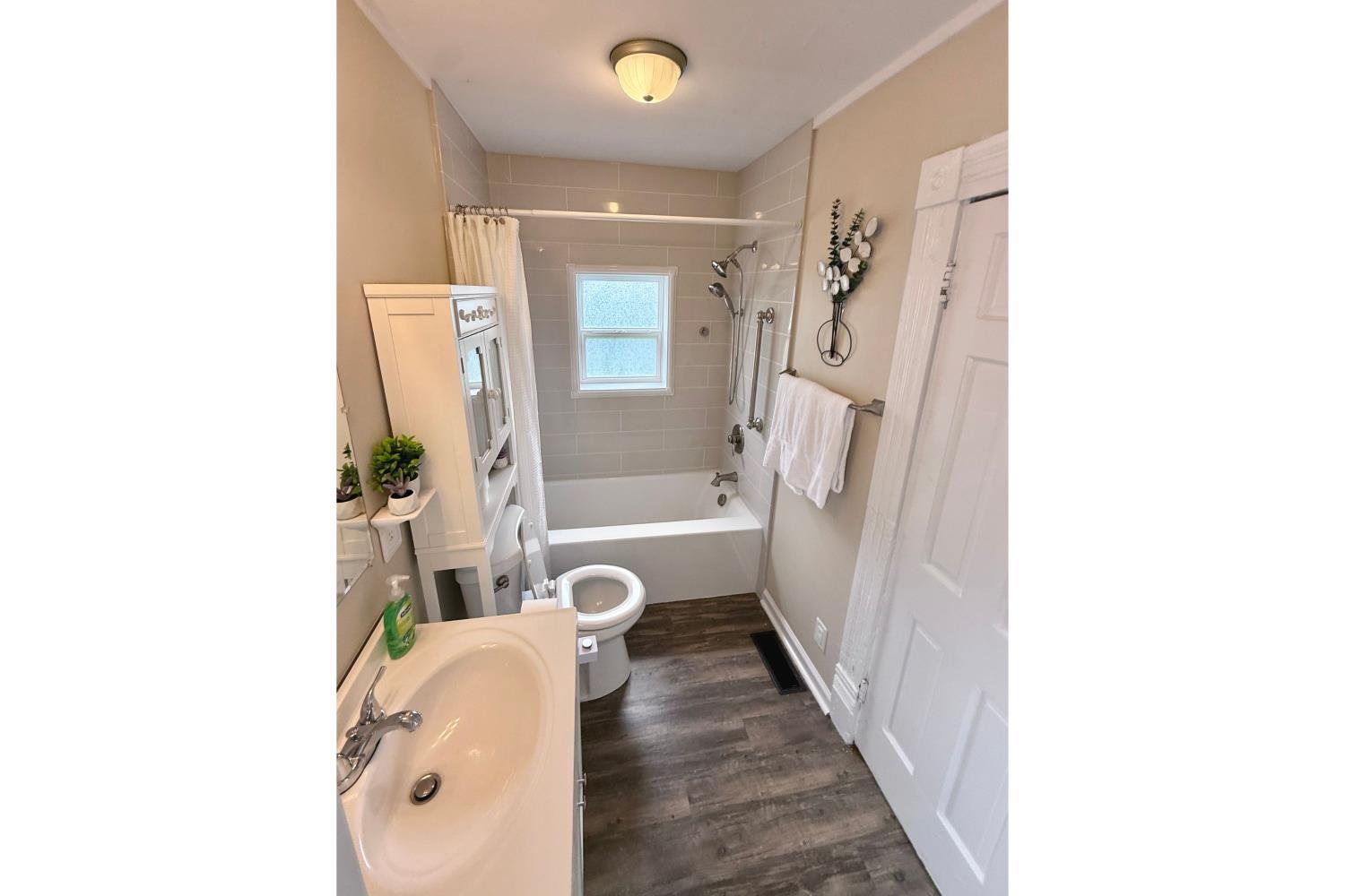 2225 Sabine Street Lynchburg, VA 24501 - Photo 2 of 13 a bathroom with a tub and shower