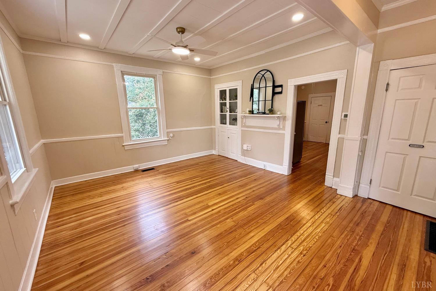 2225 Sabine Street Lynchburg, VA 24501 - Photo 4 of 13 a view of a livingroom with wooden floor and kitchen space with furniture