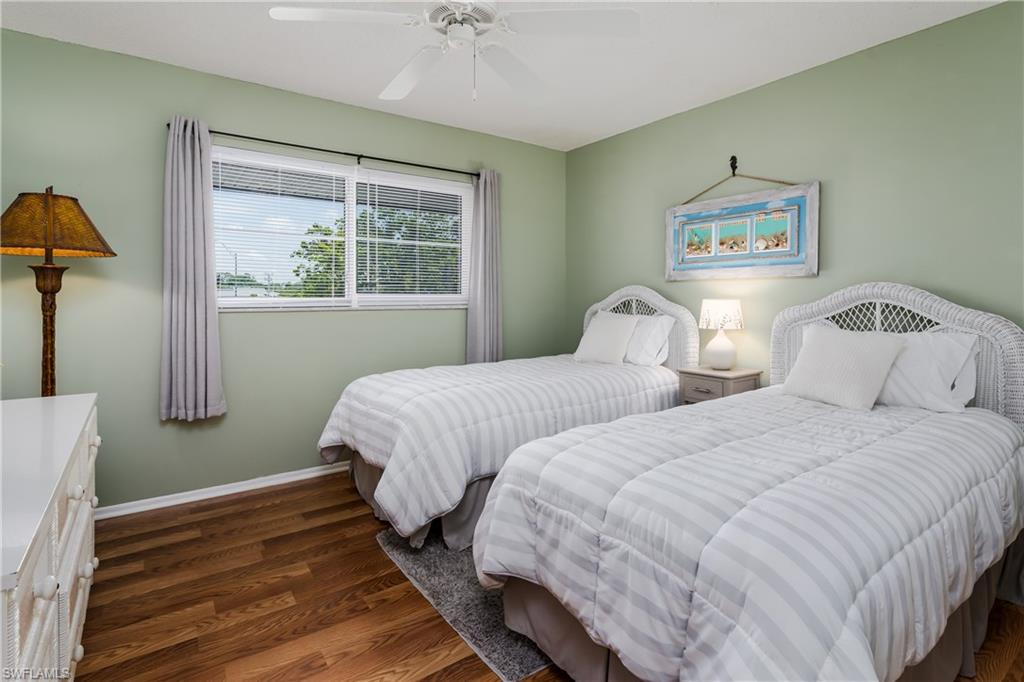 5419 Rattlesnake Hammock Road, Unit 307F Naples, FL 34113 - Photo 9 of 22 a bedroom with two beds and a window
