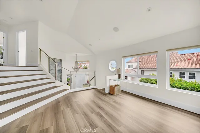 a bedroom with a bed lamp and a potted plant