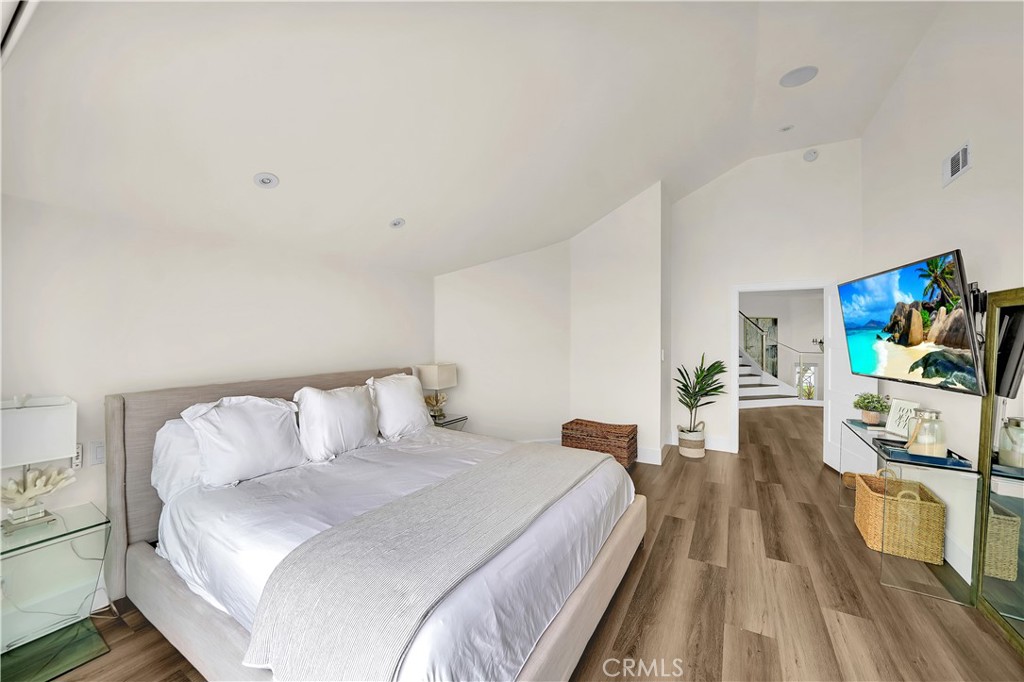 5 Regatta Way Dana Point, CA 92629 - Photo 21 of 32 a bedroom with a bed and a flat screen tv