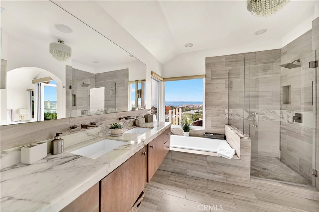 5 Regatta Way Dana Point, CA 92629 - Photo 23 of 32 a large white bathroom with a double vanity sink a mirror and a shower