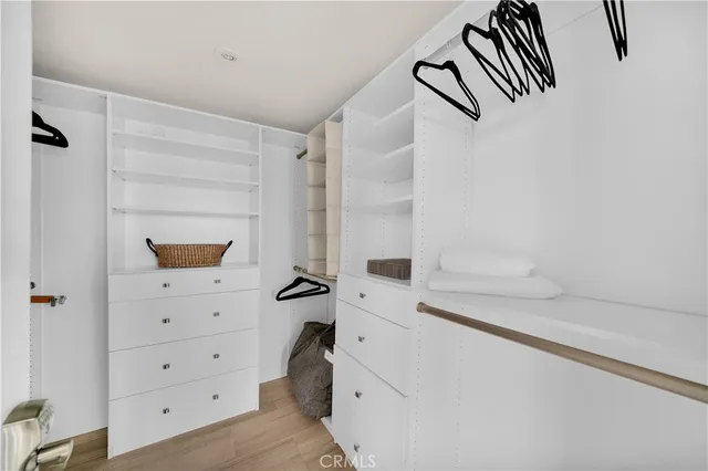 a bathroom with a granite countertop sink mirror vanity and toilet