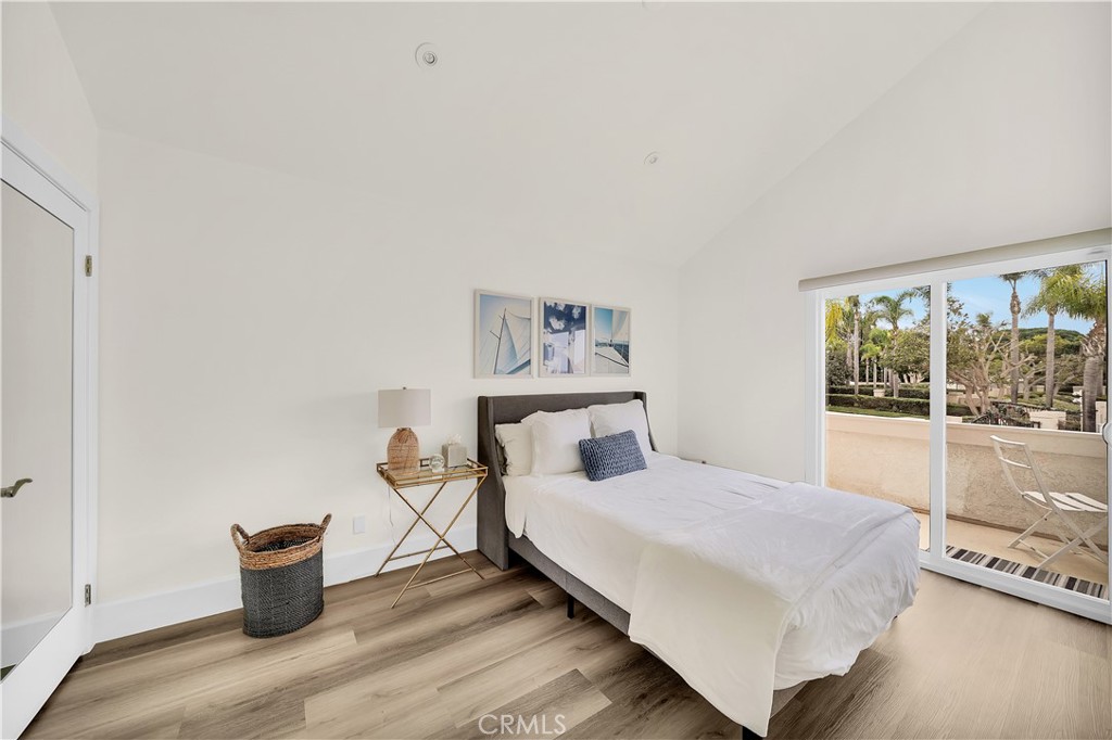5 Regatta Way Dana Point, CA 92629 - Photo 27 of 32 a bedroom with a bed and window