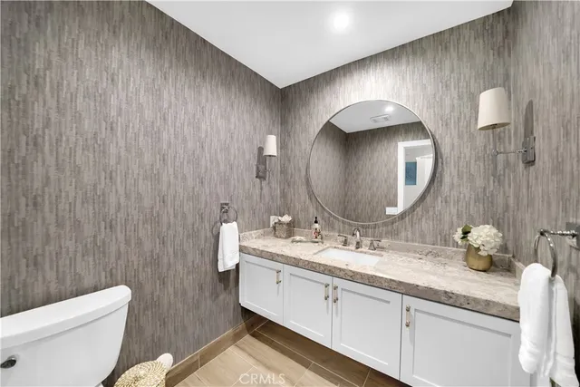 a view of a patio with a table chairs and a garden