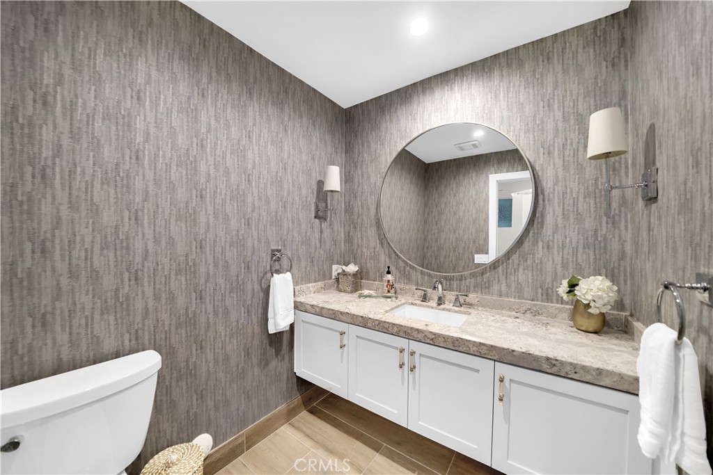 5 Regatta Way Dana Point, CA 92629 - Photo 28 of 32 a bathroom with a toilet a sink and mirror