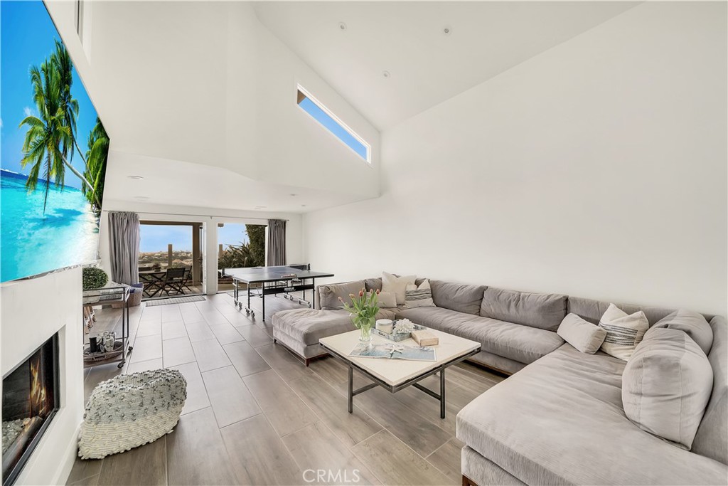 5 Regatta Way Dana Point, CA 92629 - Photo 8 of 32 a living room with furniture and a fireplace