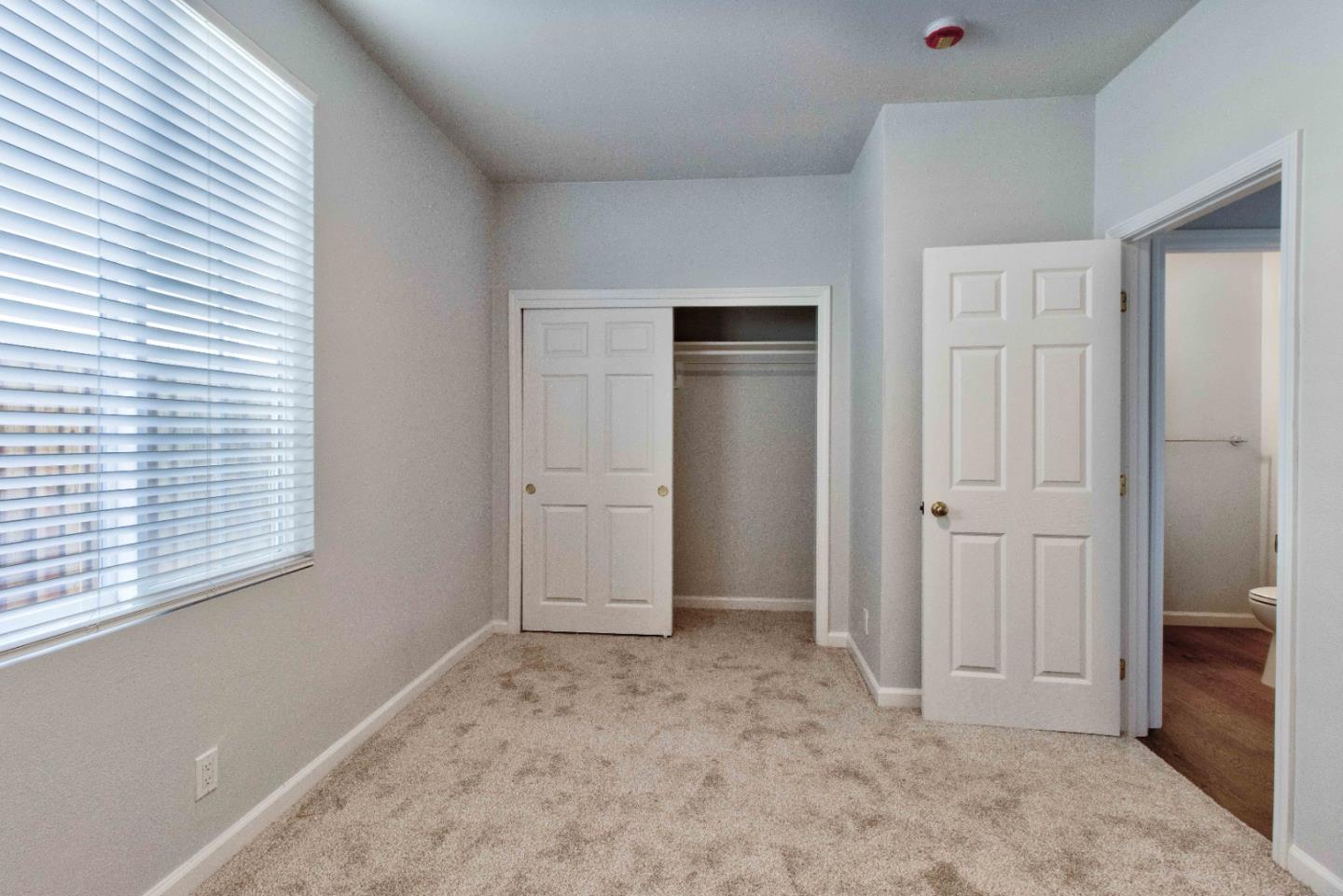 2715 Shellgate Circle Hayward, CA 94545 - Photo 15 of 47 an empty room with windows and closet
