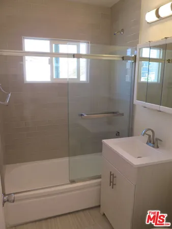 a bathroom with a sink and a bathtub