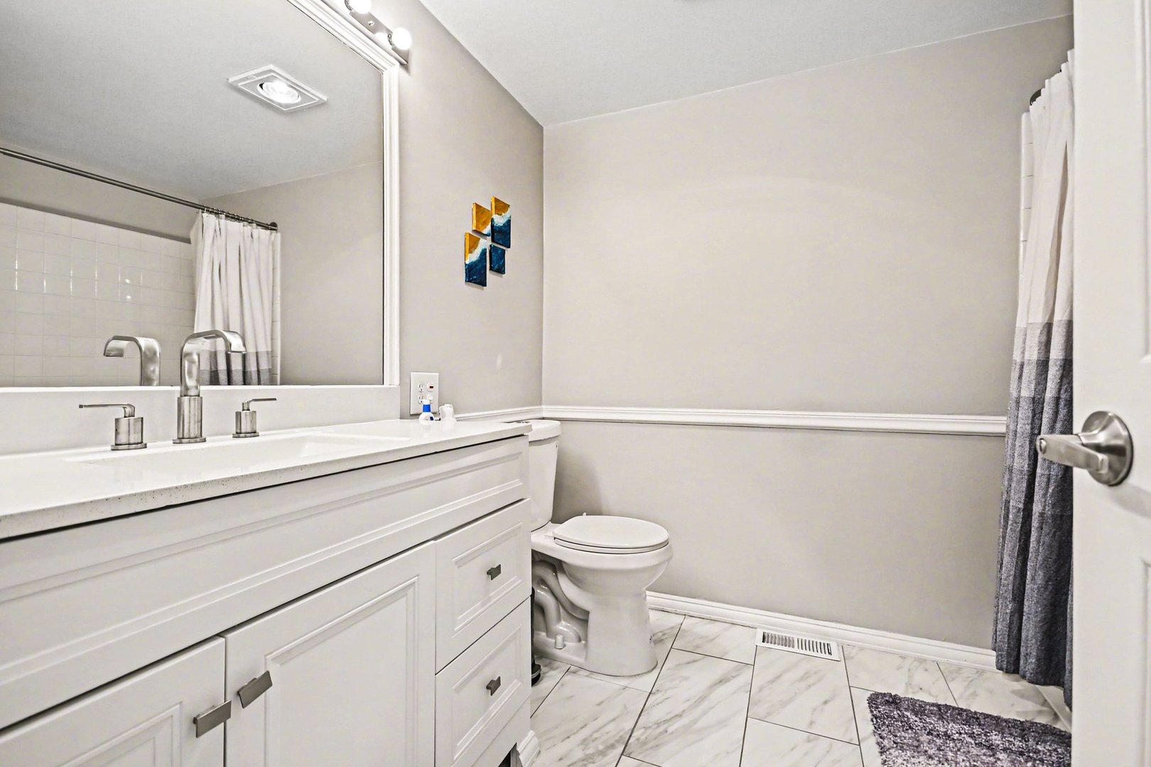 2057 Lancaster Circle, Unit 102D Naperville, IL 60565 - Photo 11 of 15 a bathroom with a sink mirror vanity and toilet