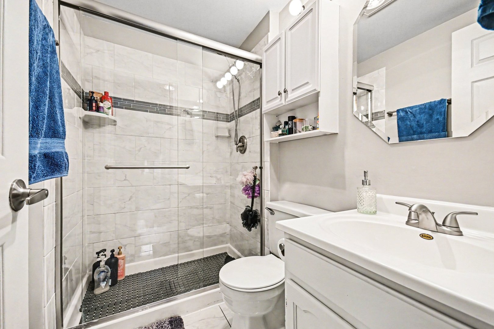 2057 Lancaster Circle, Unit 102D Naperville, IL 60565 - Photo 13 of 15 a bathroom with a sink toilet and shower