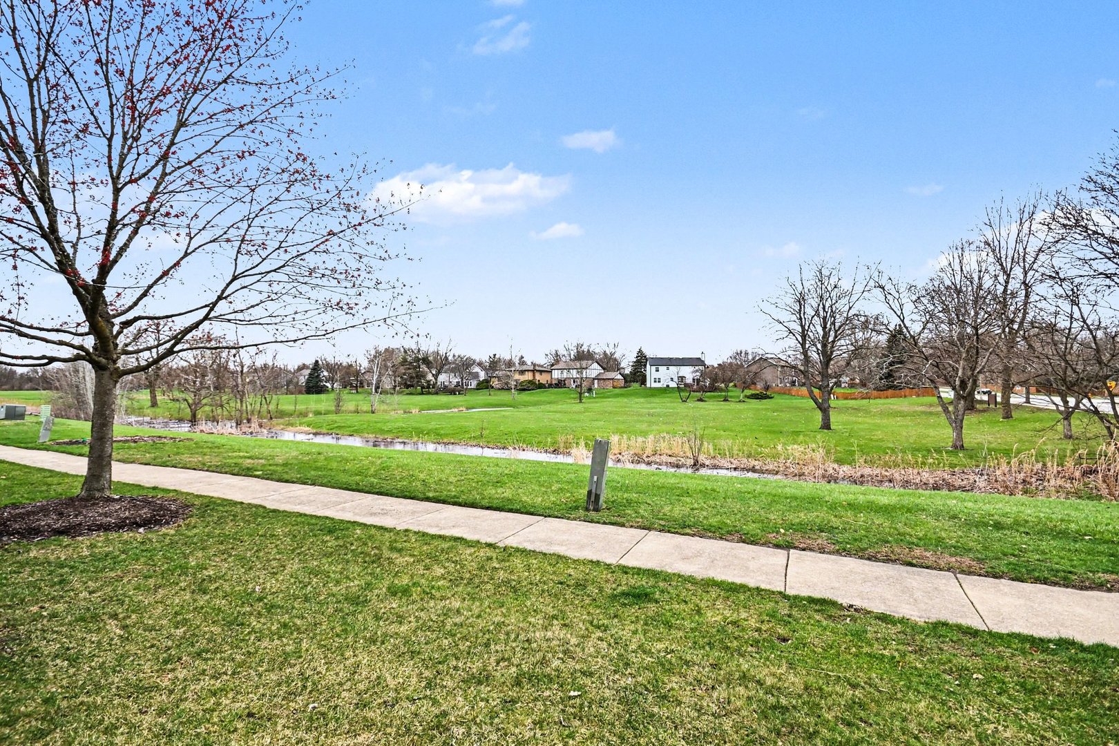 2057 Lancaster Circle, Unit 102D Naperville, IL 60565 - Photo 14 of 15 a view of a park with large trees