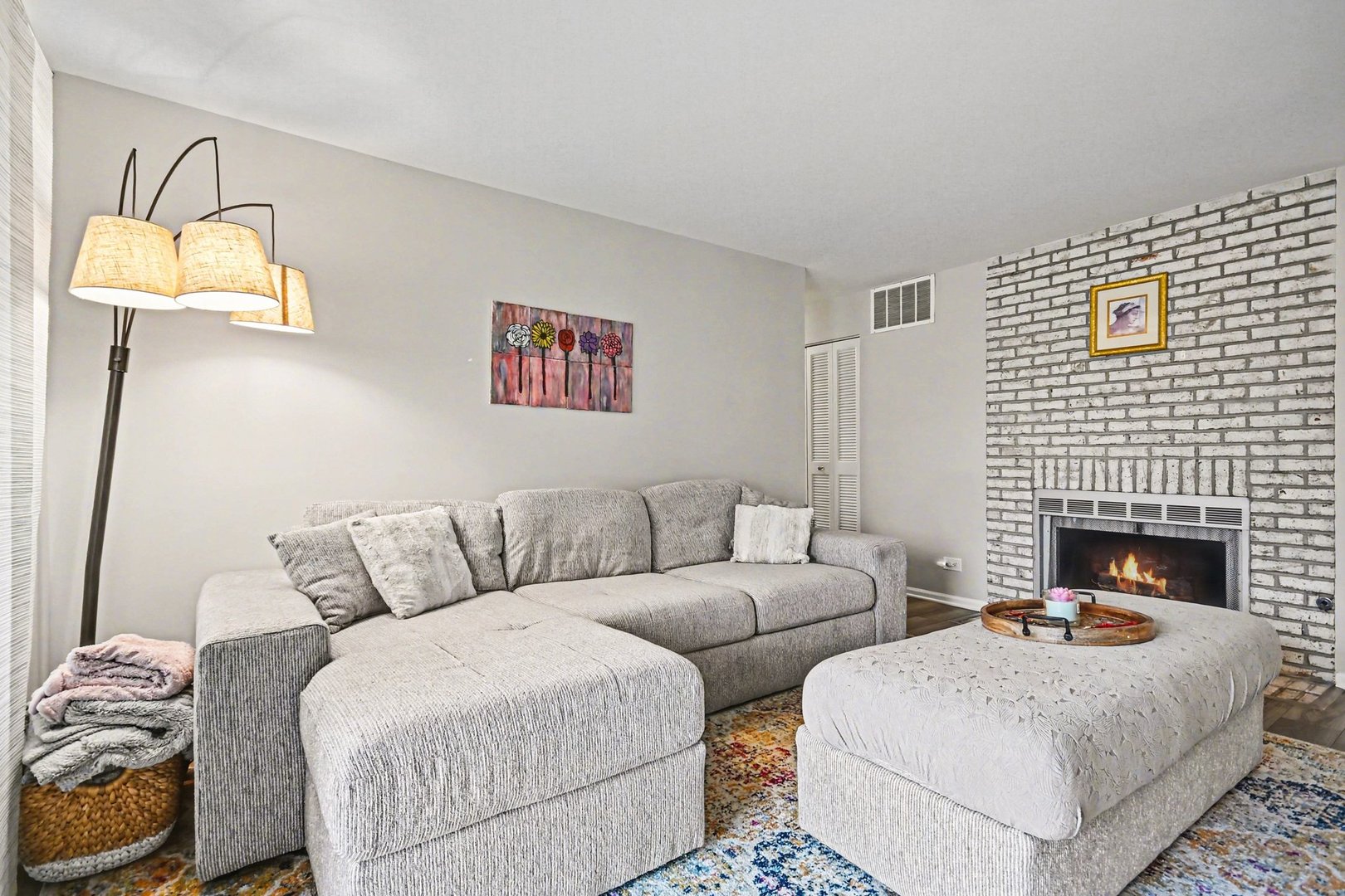 2057 Lancaster Circle, Unit 102D Naperville, IL 60565 - Photo 3 of 15 a living room with furniture and a fireplace