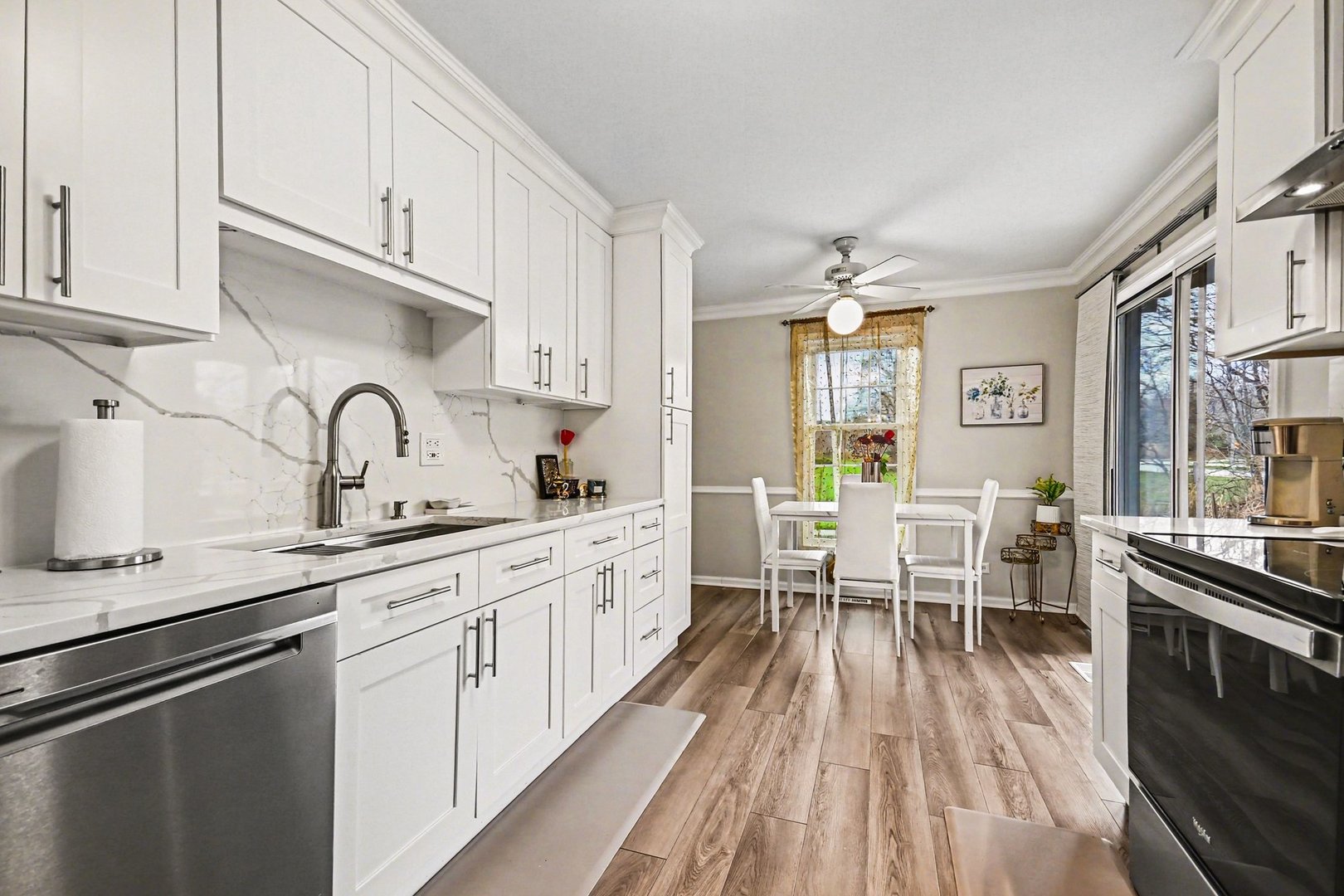 2057 Lancaster Circle, Unit 102D Naperville, IL 60565 - Photo 7 of 15 a kitchen with granite countertop lots of counter top space and stainless steel appliances