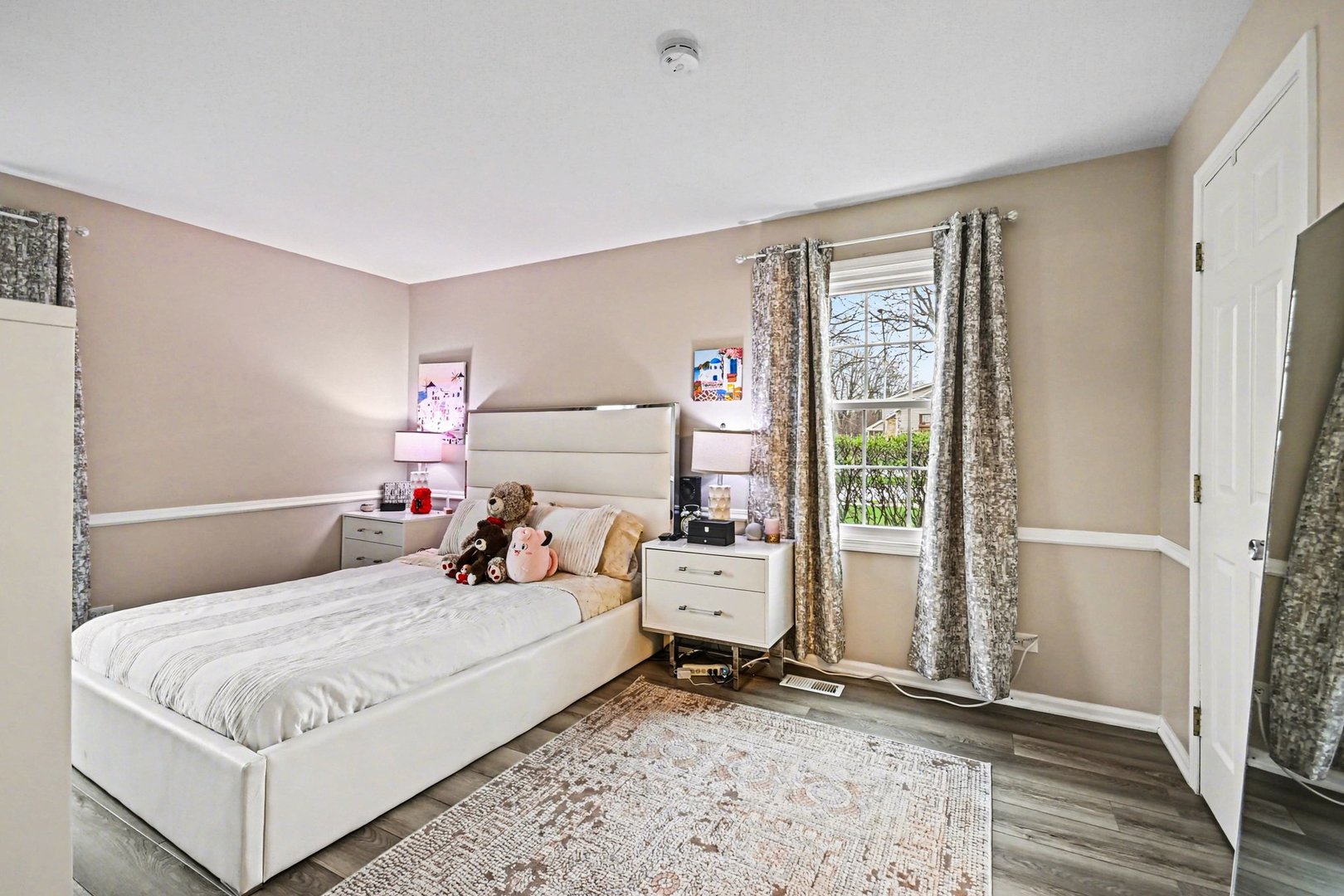 2057 Lancaster Circle, Unit 102D Naperville, IL 60565 - Photo 9 of 15 a bedroom with a bed and wooden floor