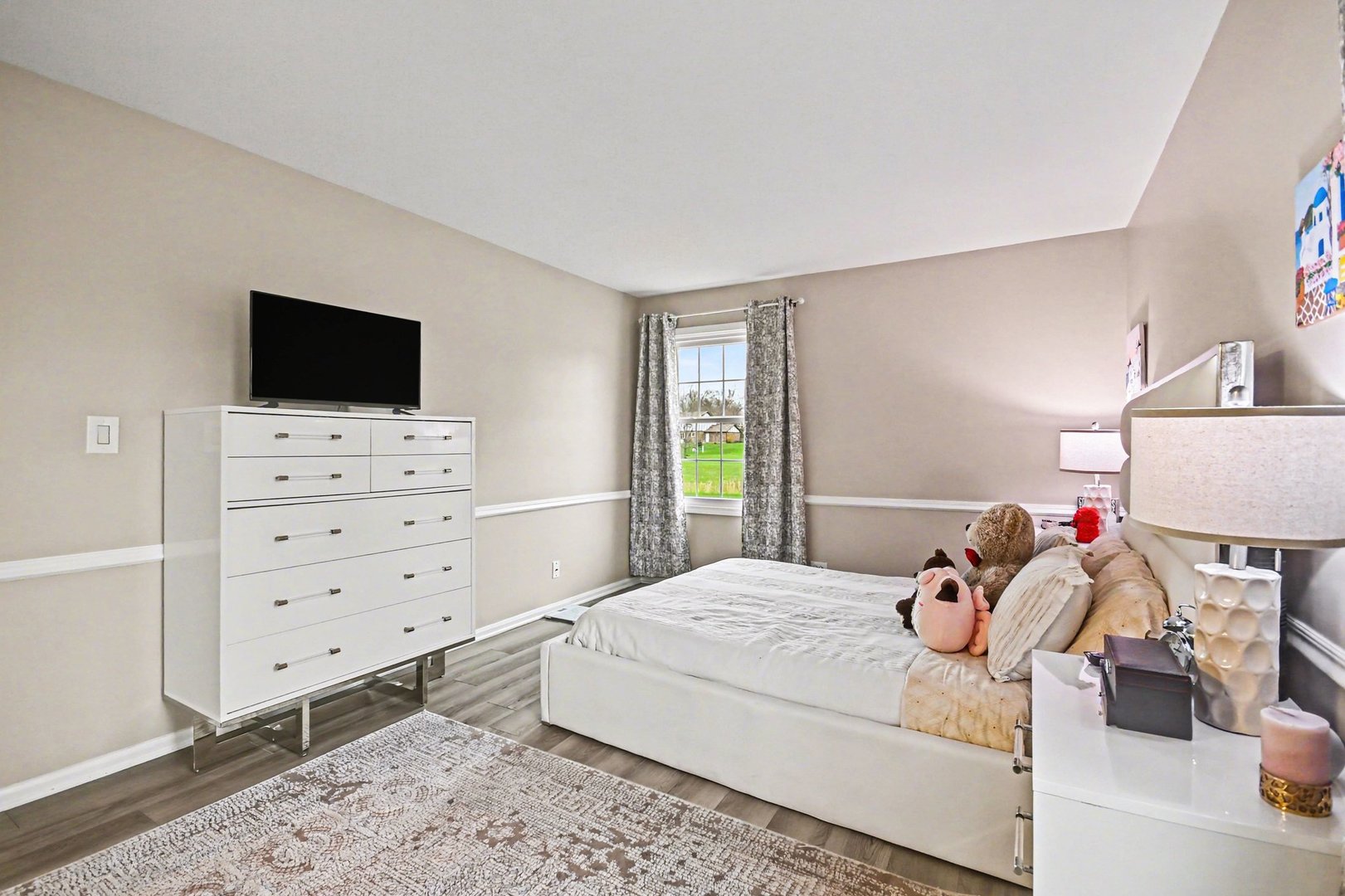 2057 Lancaster Circle, Unit 102D Naperville, IL 60565 - Photo 10 of 15 a bedroom with a bed and a flat screen tv