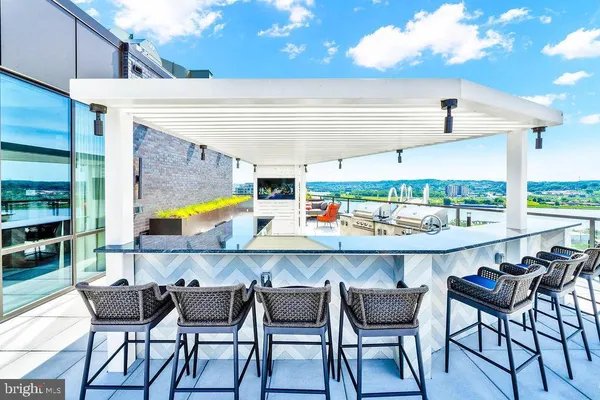 a view of a patio with a table and chairs