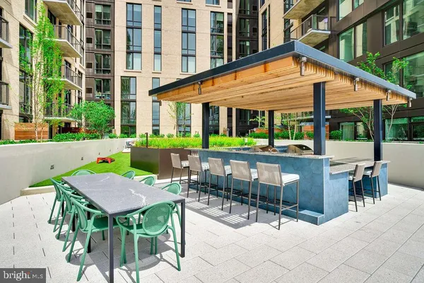 a view of a swimming pool and chairs in patio