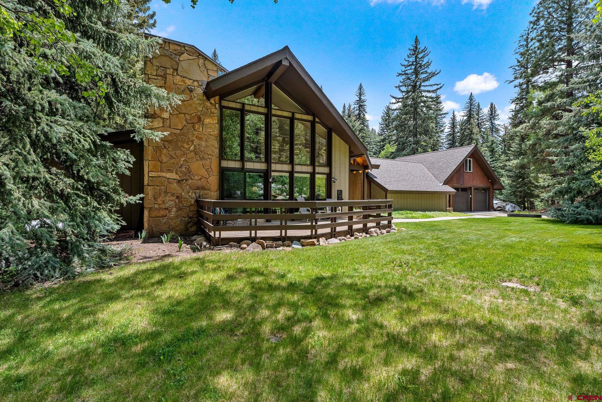 312 County Road 243 Durango, CO 81301 - Photo 3 of 33 a view of a house with backyard and sitting area