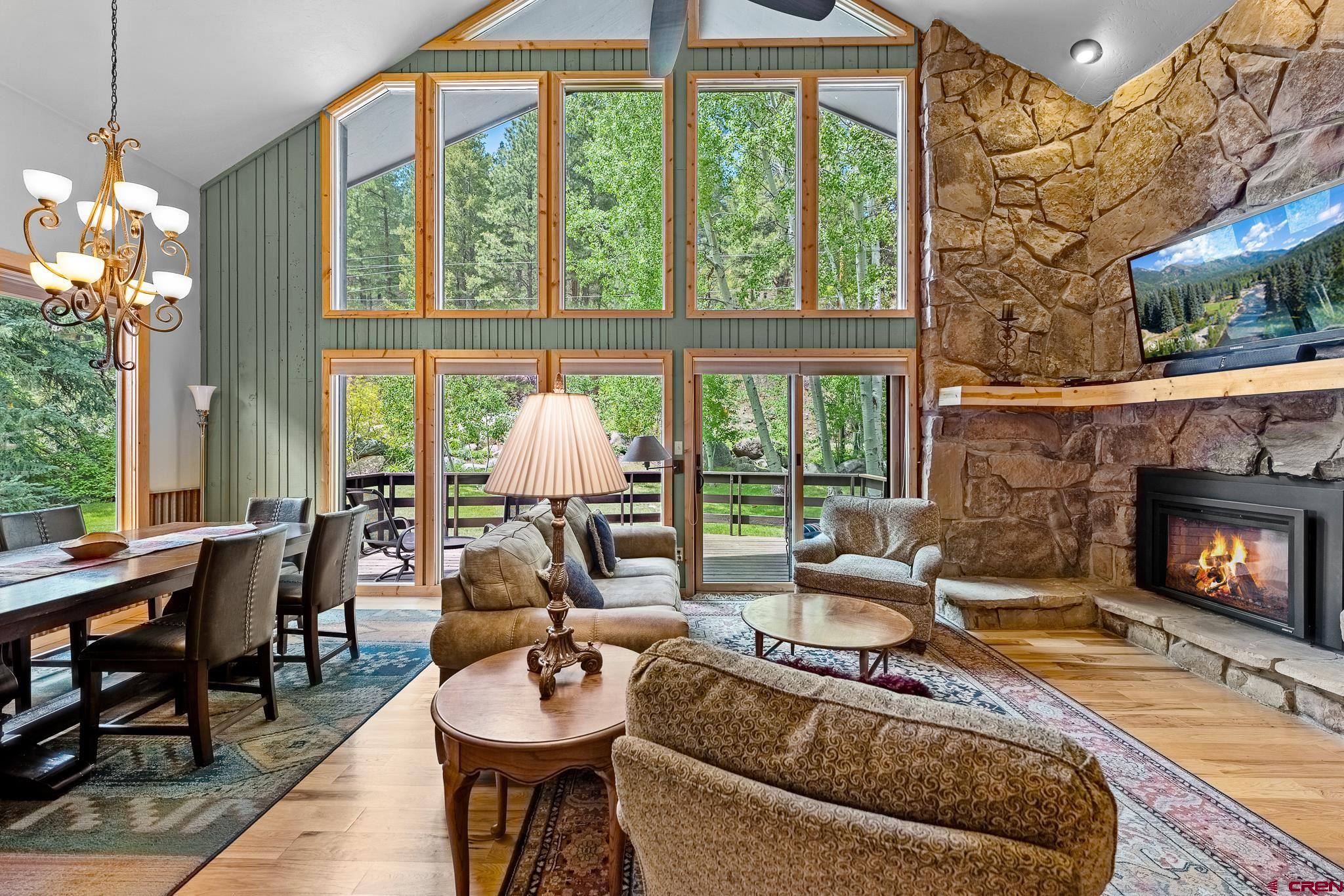 312 County Road 243 Durango, CO 81301 - Photo 10 of 33 a living room with furniture and a fireplace