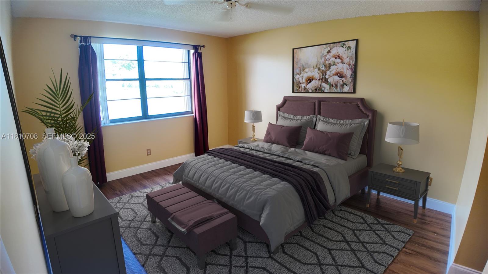 9577 West McNab Road, Unit 110 Tamarac, FL 33321 - Photo 21 of 38 a bedroom with a bed and wooden floor