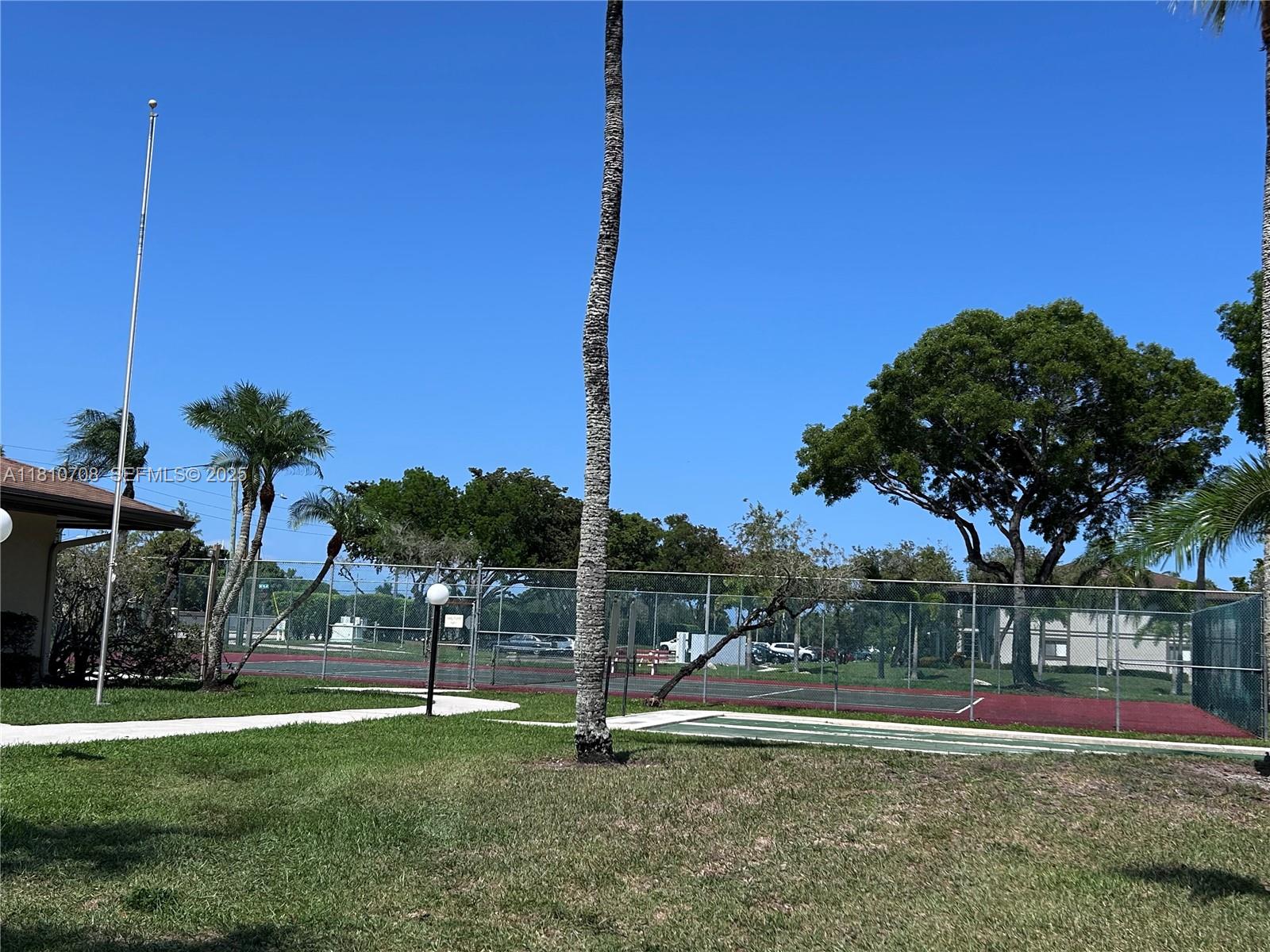9577 West McNab Road, Unit 110 Tamarac, FL 33321 - Photo 35 of 38 a view of outdoor space with garden
