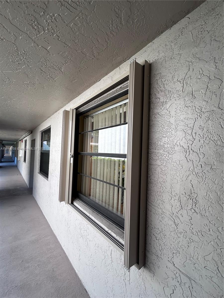 9577 West McNab Road, Unit 110 Tamarac, FL 33321 - Photo 36 of 38 New Shutters.