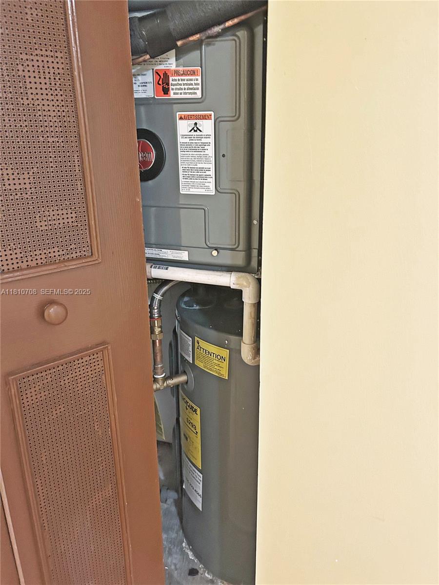 9577 West McNab Road, Unit 110 Tamarac, FL 33321 - Photo 37 of 38 a utility room with dryer and washer