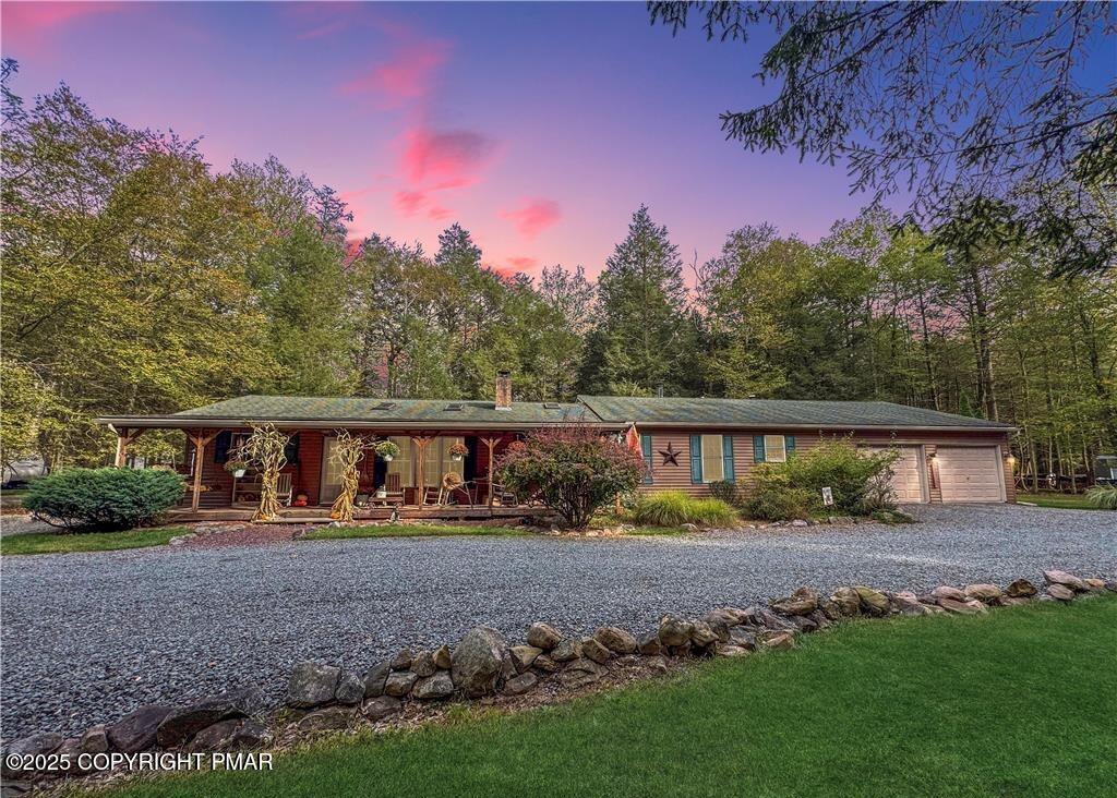 a view of house with outdoor space and yard