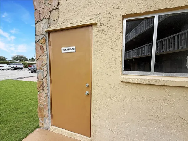 a view of a door and chair in the balcony