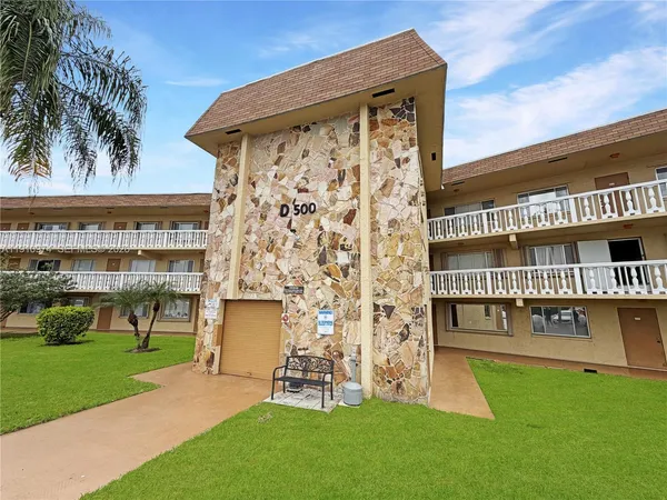 front view of a building with a yard