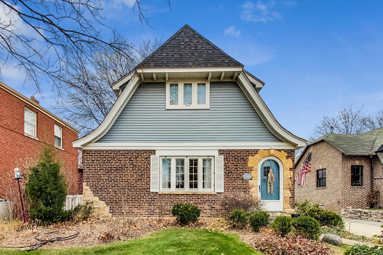 280 Nuttall Road Riverside, IL 60546 - Photo 2 of 52 a front view of a house with garden