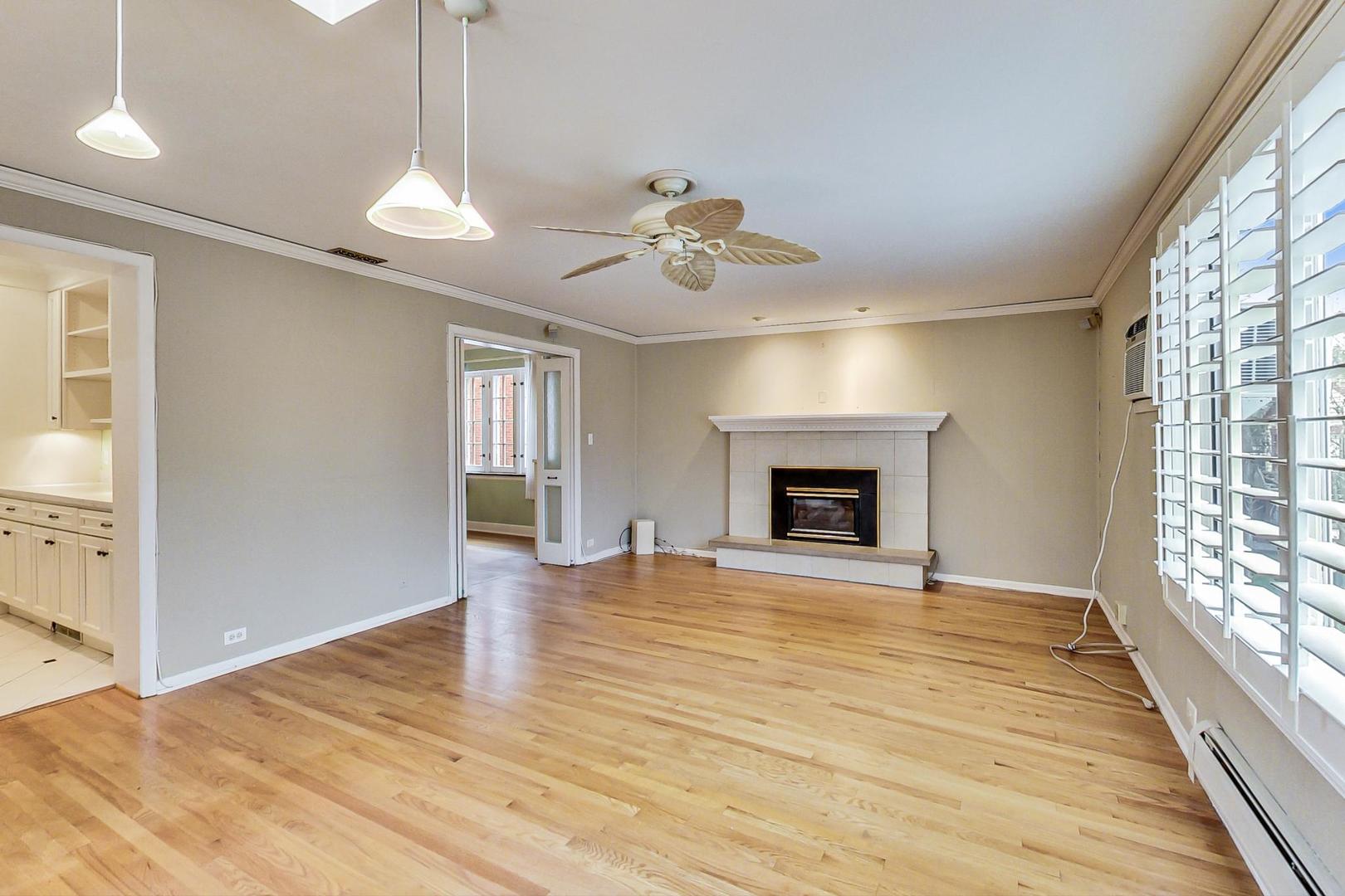 280 Nuttall Road Riverside, IL 60546 - Photo 12 of 52 a view of an empty room with a window and fireplace