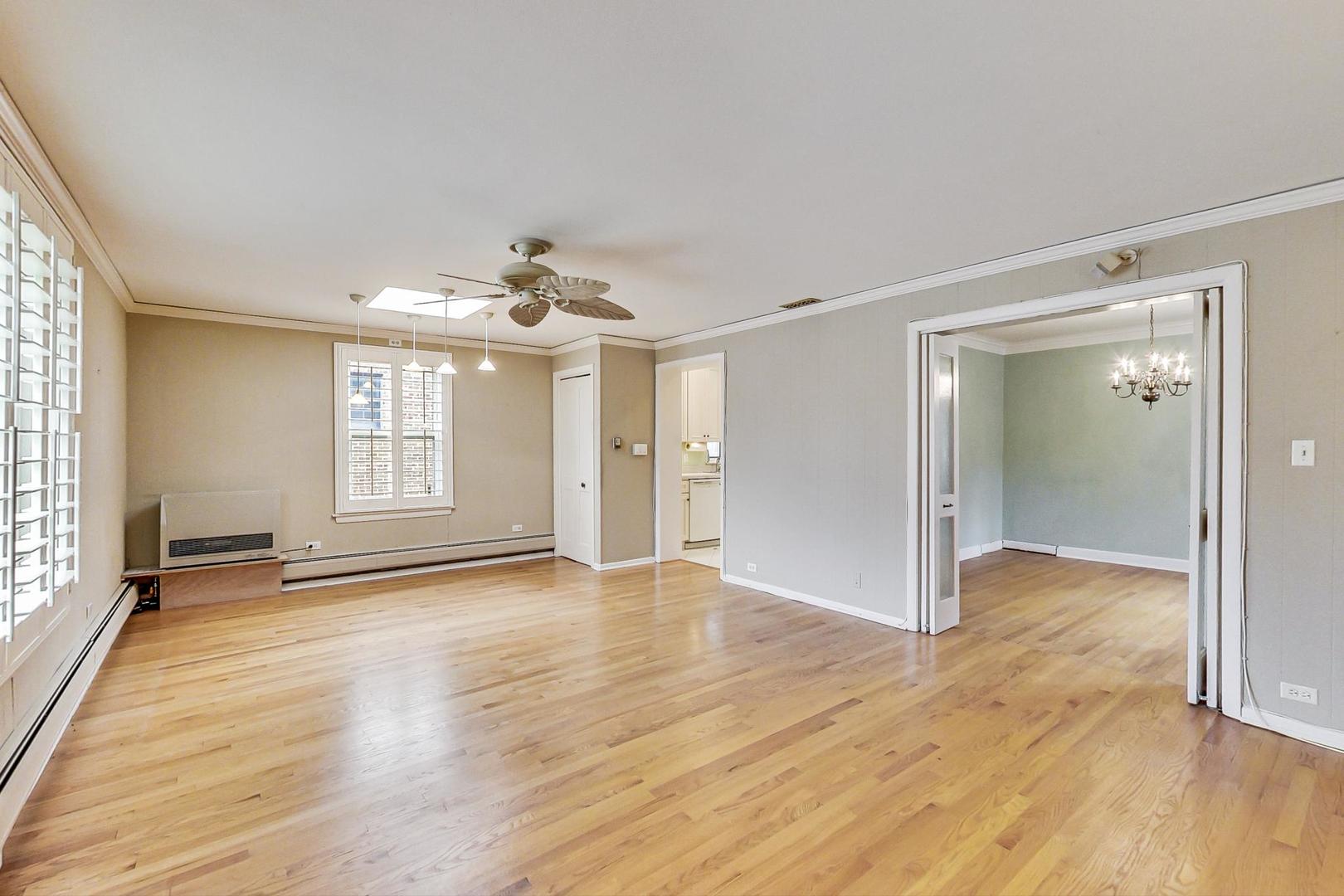 280 Nuttall Road Riverside, IL 60546 - Photo 13 of 52 a view of an empty room with wooden floor and a window